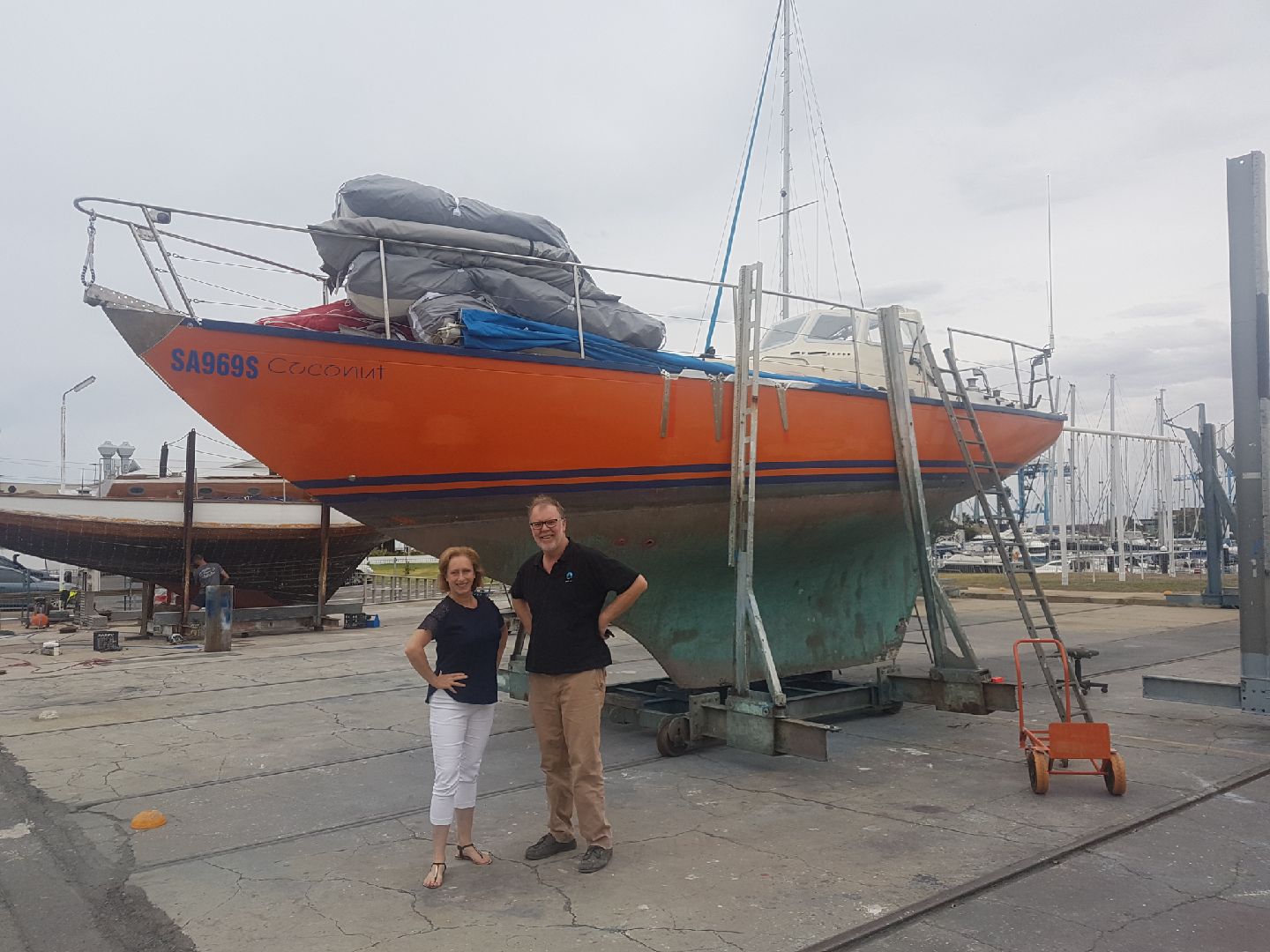 Anne and Luke from Bravo Sails standing with Coconut before the Golden Globe Race